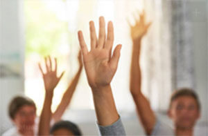 Students raising hands